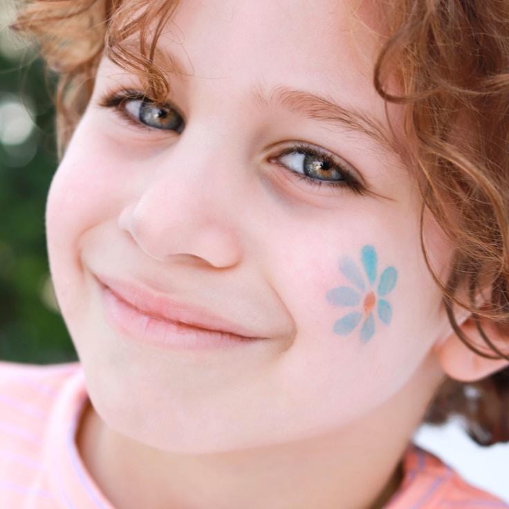 Ava Lin, Lead Design Curator at EmberTrailHome, reviewing corporate floral arrangements